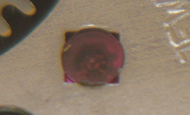 detail: pressed cap jewel